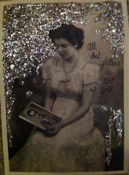 Portrait of a woman holding a photo of a man, looking longingly at the photo. There is silver glitter around the woman, and handwritten text that reads "All that glitters is not gold"