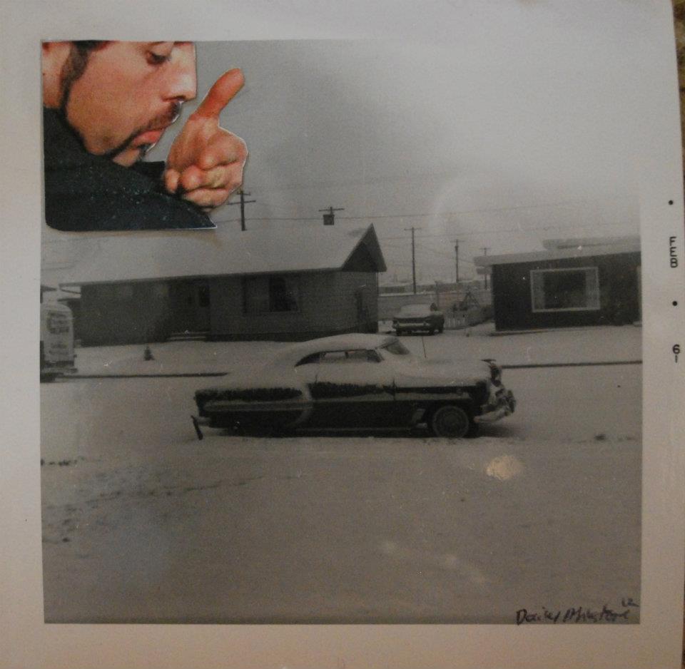 Photo of a 1950s car covered in snow in a neighborhood. A collaged person wiping dandruff on their shoulder is in the top left, making it look like the snow is dandruff.